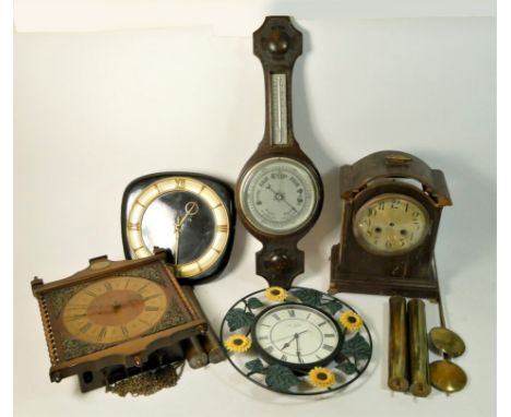 A collection of clocks to include, a Hitachi electronic clock radio, a W.M Widdop sunflower wall clock, a wall hanging barome