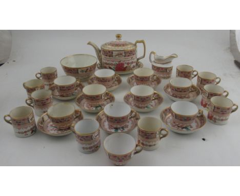 An early 19th century English porcelain, possible Spode tea and coffee service, decorated in colours with flowers and small p