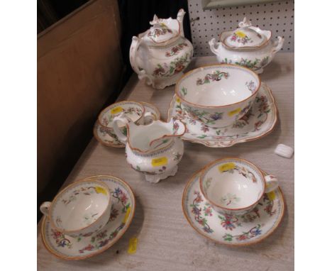 A 19th century part tea service, comprising tea pot, covered sugar bowl, jug, slop bowl, sandwich plate and three cups and sa