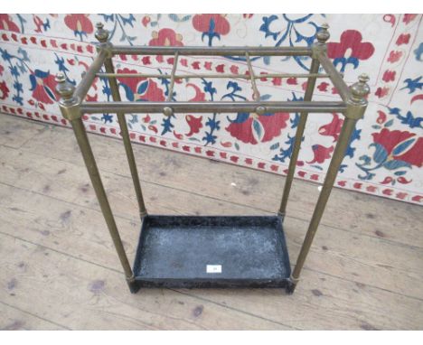 A brass 6 division stick stand, width 16ins, height 24ins&nbsp;