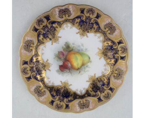 A Royal Worcester cabinet plate, the centre decorated with fruit by Sebright, with a rich dark blue and gilt border, diameter