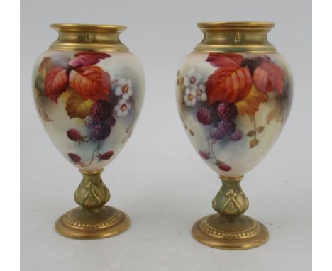 A pair of Royal Worcester pedestal vases, decorated autumnal fruits and leaves, shape number 2260, height 6insCondition Repor