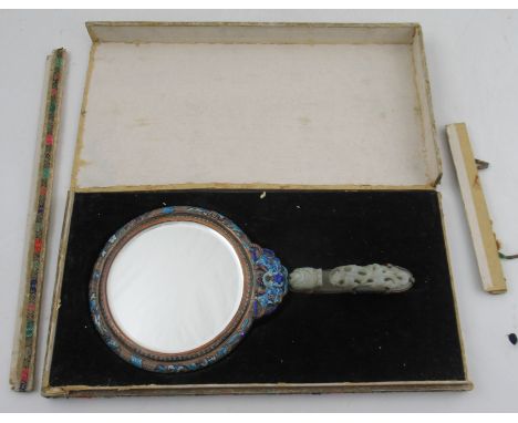 A Chinese enamelled ladies hand mirror, with a 19th century dragon green hard stone belt buckle handle, length 12ins&nbsp;&nb