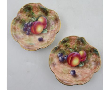 A pair of Royal Worcester dishes, decorated fruit to a mossy background by Freeman, diameter 4.75ins