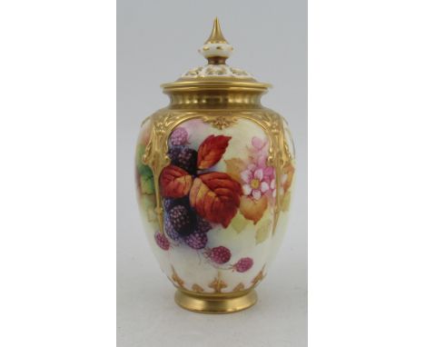 A Royal Worcester covered vase, the quarter lobed body decorated autumnal fruits and leaves by Kitty Blake, shape number H169