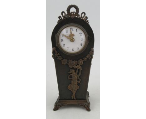 A metal cased mantel clock, with white enamel dial, the case applied with gilt metal sways and Classical figure, height 9ins