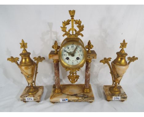 A decorative early 20th century portico styled mantel clock with floral swag decoration and matching gilded hands, the clock 