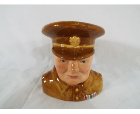 Cartlon Ware - a ceramic Carlton Ware toby jug in the form of Winston Churchill with army uniform. Estimate £30 - £50