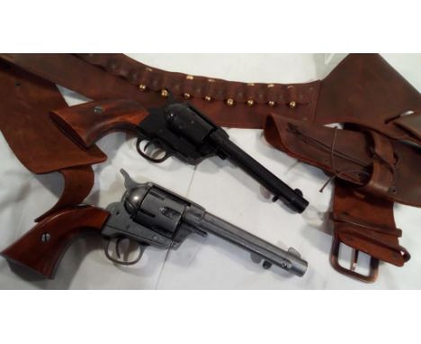 Two replica single action army .45 cal revolvers, one in cowboy holster with 14 blank holding replica 'bullets'