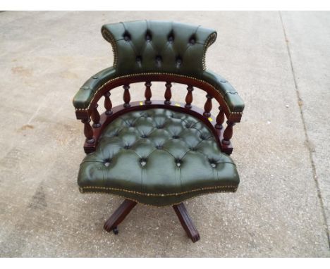 A good quality leather button back captains chair.