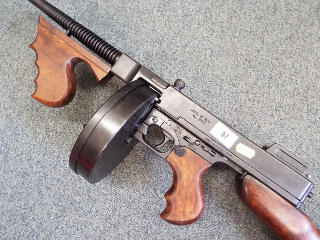 A replica Thompson sub machine gun (.45 ACP) with drum magazine and