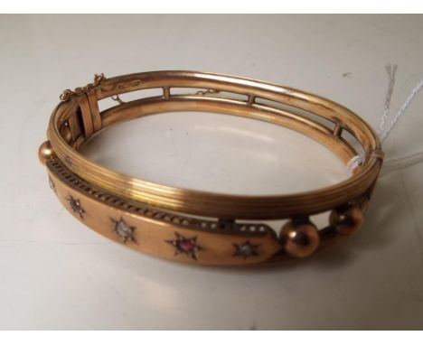 A lady's hallmarked 9 carat gold stone set bangle, approx. weight 16.48 gm - Est £150 - £200