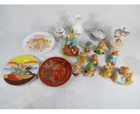 A good lot to include five Pendelfin rabbit figurines, three Tinker Ware rabbits, a Peter Rabbit figurine money bank designed