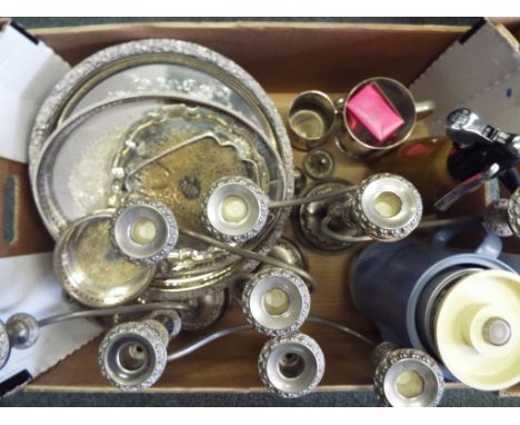 A good lot to include a quantity of plated ware to include candlesticks, trays, cups, cruet set, pots also included in the lo