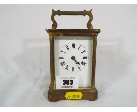 A brass cased carriage timepiece, cylinder escapement, white enamel dial with Roman numerals, with key, Est £30 - £50