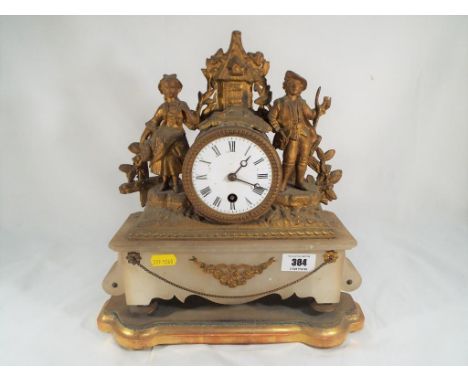 A spelter and alabaster cased French mantel clock, timepiece only, the movement in a fluted drum flanked by a romantic couple