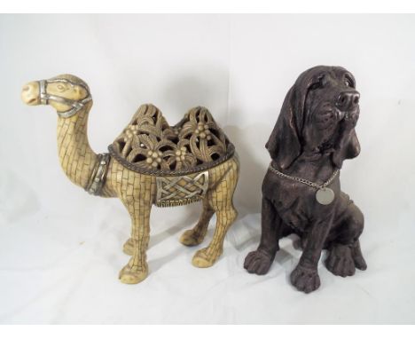 An unusual large figurine candle holder in the form of a camel from the Kinder Collection, Austin model No. HT0001 and a fire