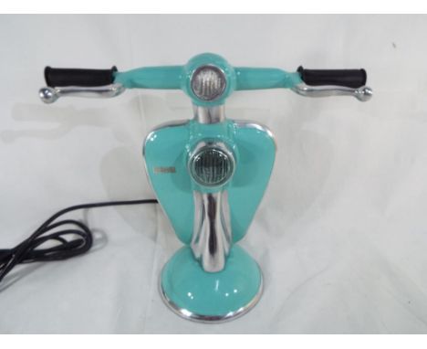 An unusual table lamp in the form of a Lambretta scooter, 28 cm (h). Estimate £50 - £80