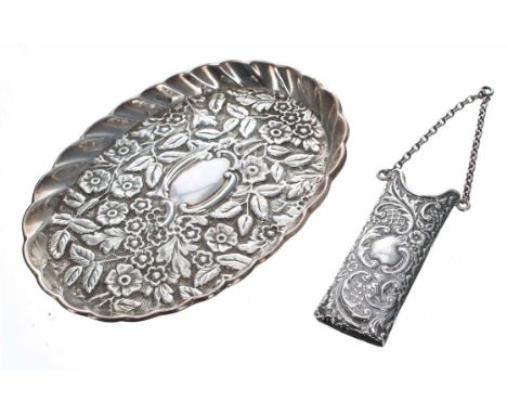 Victorian repoussé silver comb case on chain, with foliate and scroll decoration, contains a tortoiseshell comb (** the comb 