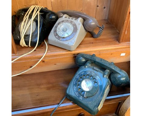 Three vintage rotary dial telephones, one bearing label for Dorchester; together with an oak cased mantel clock 