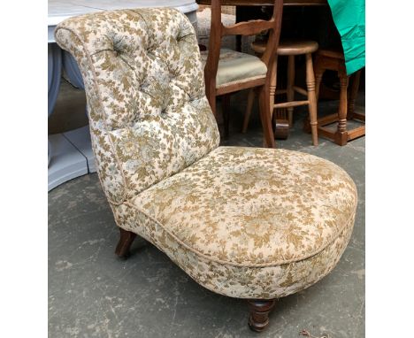 A 19th century button back bedroom chair on turned legs and casters 