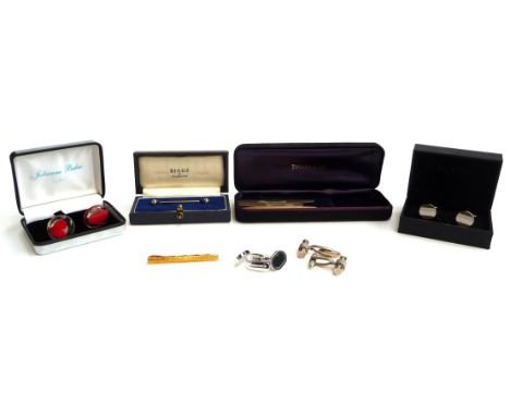 A quantity of cufflinks to include Burberry cufflinks set with bloodstone; a pair of boxed Hugo Boss cufflinks; a pair of whi