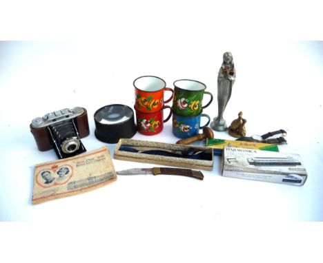 A small mixed lot to include 4 enamel mugs, Darning mushroom, cigarette cards, harmonicas, Eastern knives, Agfa Isolette III 