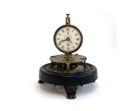 A late 19th/early 20th century brass perpetual motion clock with rotary spherical pendulum, the circular enamel dial set with