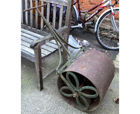 A large cast iron garden roller 