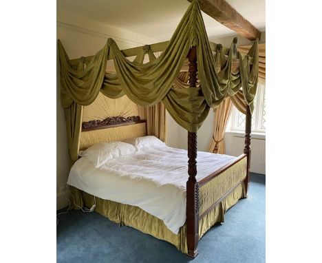 A French four-poster bed, carved headboard and spiral turned posts, with green silk hangings, complete with unused mattress, 