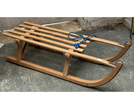 A Davos 90 beechwood child's sled, 91cmL 