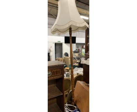 A turned wood standard lamp with shade, 170cmH to top of shade, 