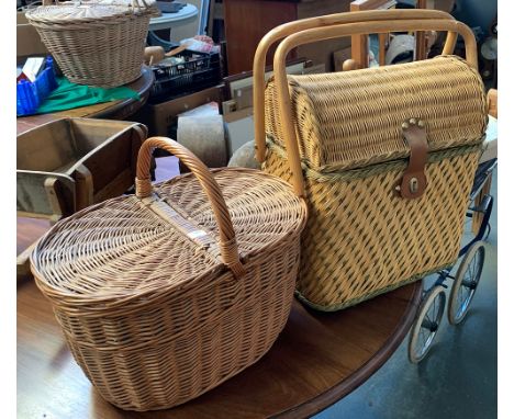 A wicker picnic hamper together with two other wicker baskets 