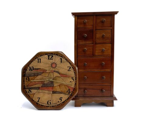 A workshop Wales at fishguard wall clock, 31cmD, numbered 50 out of 88, together with a set of hardwood drawers, 51 cmH 