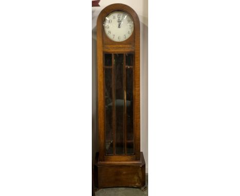An oak domed long case clock, white enamel dial with Arabic numerals, with glazed trunk, with weights and pendulum, 185cmH 