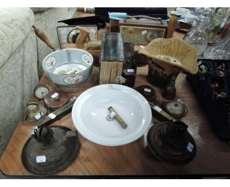 A selection of hardware including wood working tools and military oiler