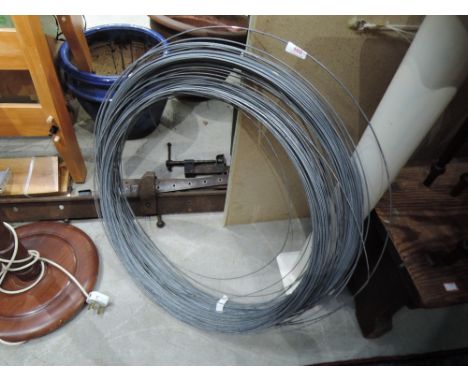 A selection of sash clamps and a roll of wire
