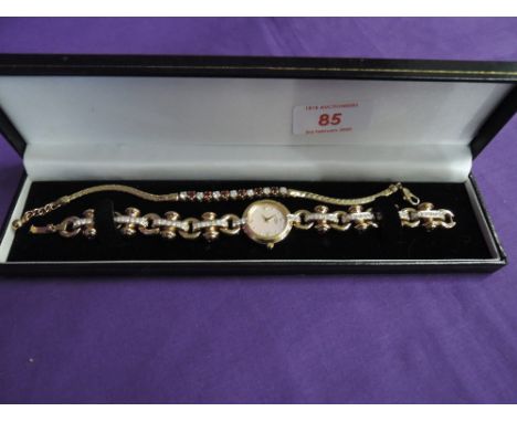 A lady's gold plated cocktail wrist watch by Rotary having dot and diamante dial to pearlised face on a diamante and paste se