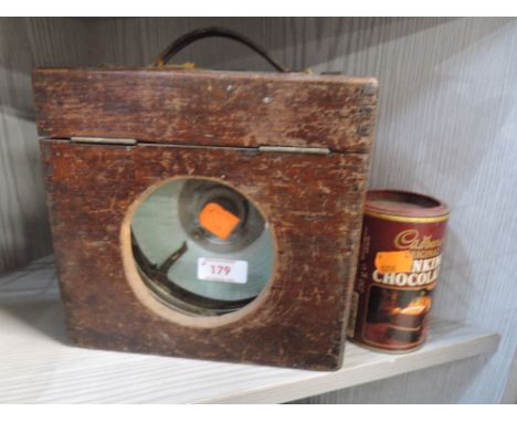 A vintage pigeon counter or clock in wooden case