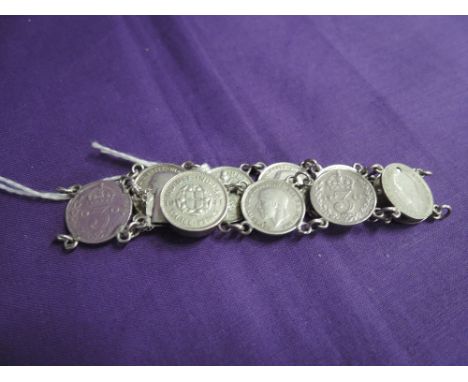 A ten coin three penny piece bracelet with chain links