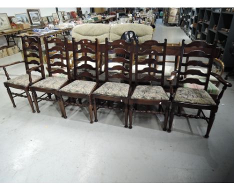 A set of six (four plus two) traditional stained frame ladder back chairs