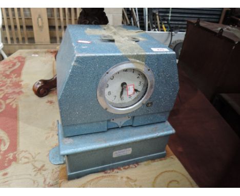 A vintage time recorder clock