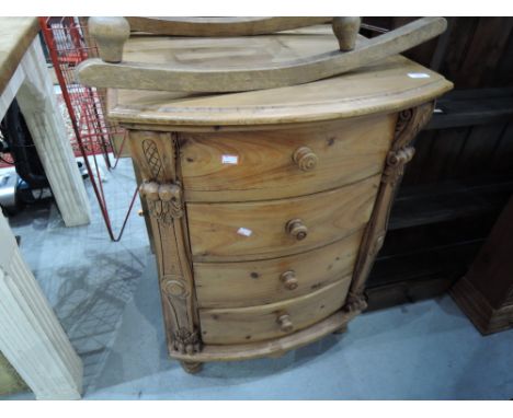 A modern pine bow front chest of 4 drawers