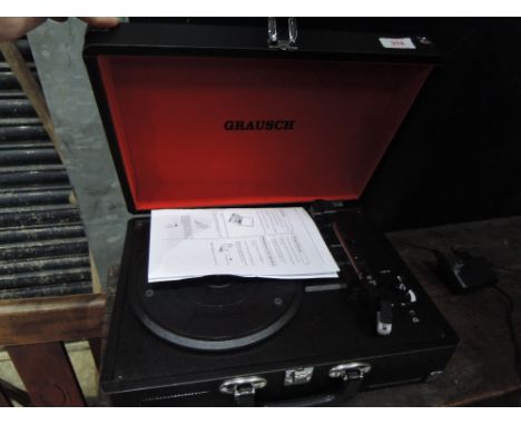 A Grausch record player in briefcase style case