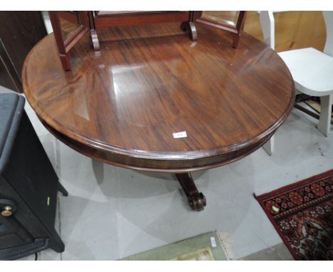 A 19th mahogany pedestal table having circular top on column and triple sweep legs reduced to coffee table height