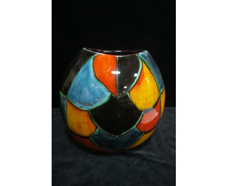 A GLAZED PORCELAIN VASE, of oval tapering form the base impressed Poole Pottery England decorated with orange blue and yellow