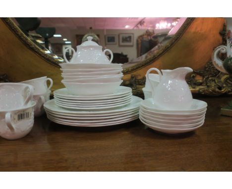 A TWENTY THREE PIECE WEDGEWOOD BONE CHINA DINNER AMD TEA SERVICE WITH STRAWBERRY AND VINE PATTERN