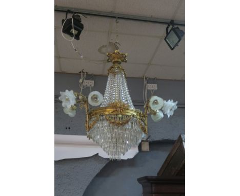 A CONTINENTAL STYLE GILT BRASS AND CUT GLASS TEAR DROP CHANDELIER, the foliate corona issuing facetted chains above the circu