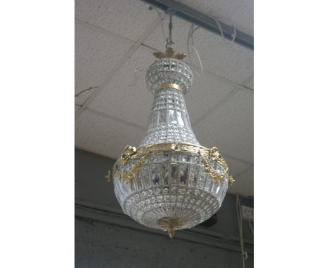 A CONTINENTAL STYLE GILT BRASS AND BEADED GLASS CENTRE LIGHT, the openwork frame filled with cut glass pendants, the brass fr