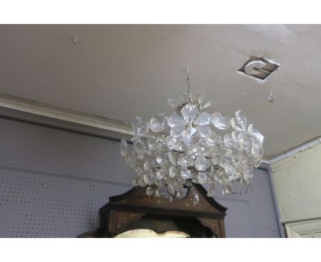 A CONTINENTAL STYLE  CUT GLASS CENTRE LIGHT, the chrome frame decorated with clustered foliates.